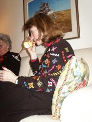 Vicky sipping while Nana unwraps